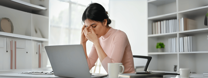 stressed and worried woman at work